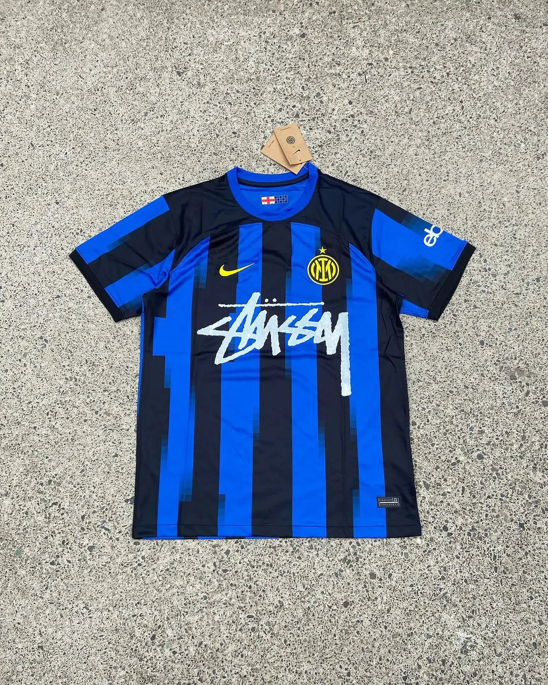 Inter Milan x Stussy Limited Jersey featuring Inter’s iconic black-and-blue stripes combined with Stussy’s bold logo, in an exclusive, limited-edition design.